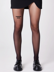 Schwarze 40 Den Strumpfhose von saintsass mit Statement Cheers 2026 auf vorderem linken Oberschenkel 